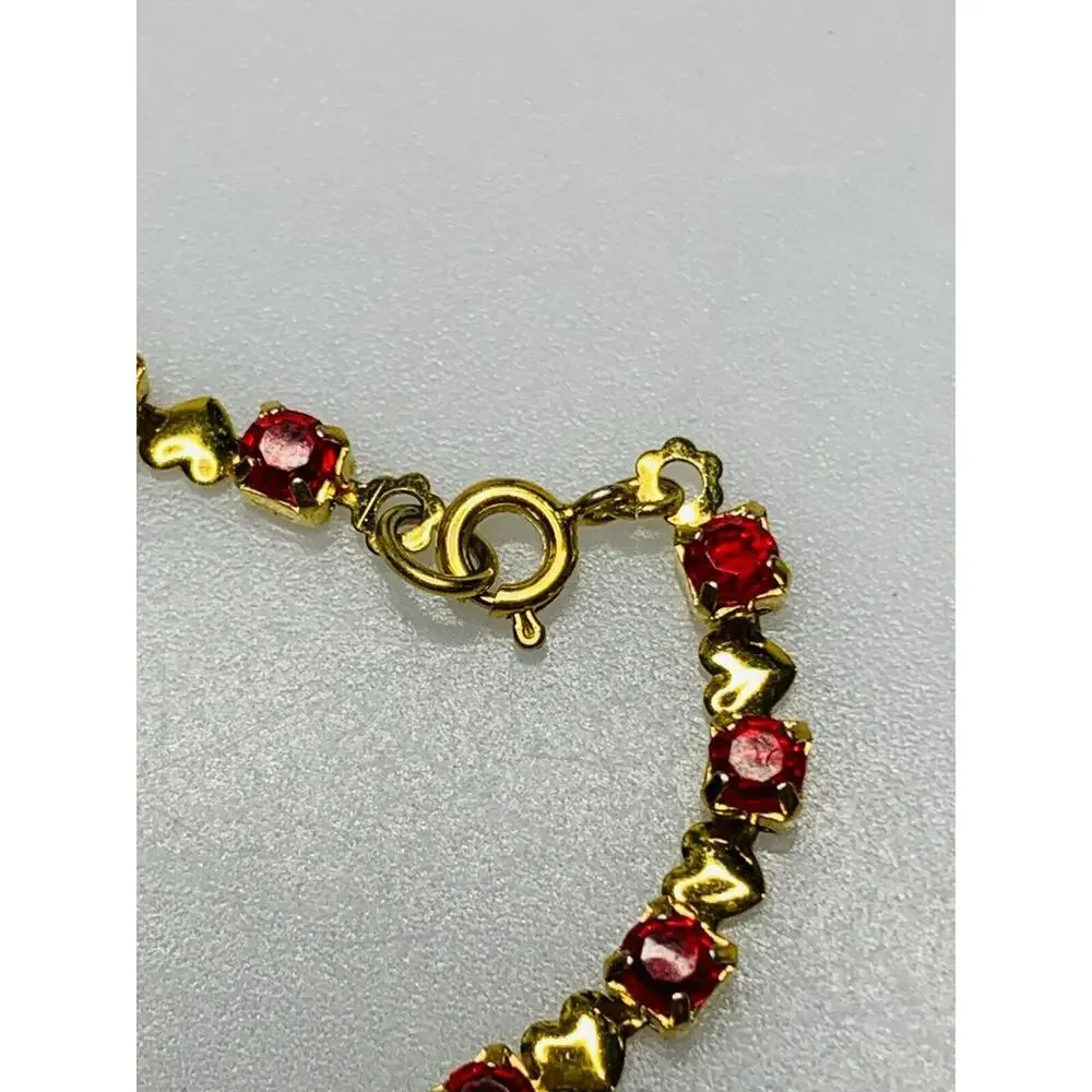 Red Stone Tennis Bracelet with Little Gold Hearts in Between Each Stone